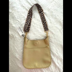 Brand new handbag with tags. Includes bonus strap